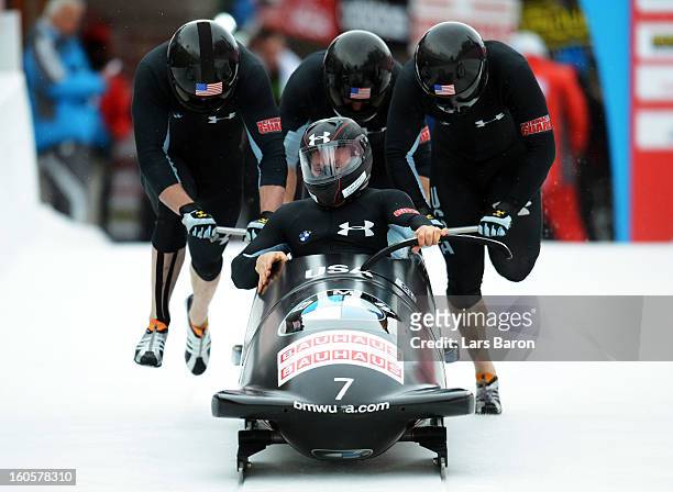 Steven Holcomb, Justin Olsen, Steven Langton and Curtis Tomasevicz of USA compete during the Four Men Bobsleigh heat three of the IBSF Bob & Skeleton...