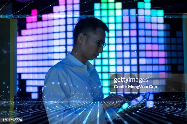 asian men work on tablets - digitization stock pictures, royalty-free photos & images
