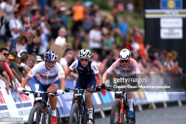 Evie Richards of Great Britain, Pauline Ferrand Prevot of France and Puck Pieterse of Netherlands compete during the Women Elite Cross-country Short...