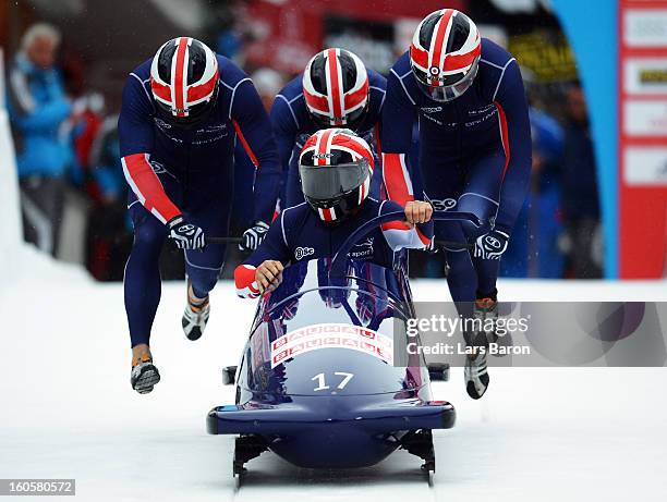 John James Jackson, Stuart Benson, Bruce Tasker and Joel Fearon of Great Britain compete during the Four Men Bobsleigh heat three of the IBSF Bob &...