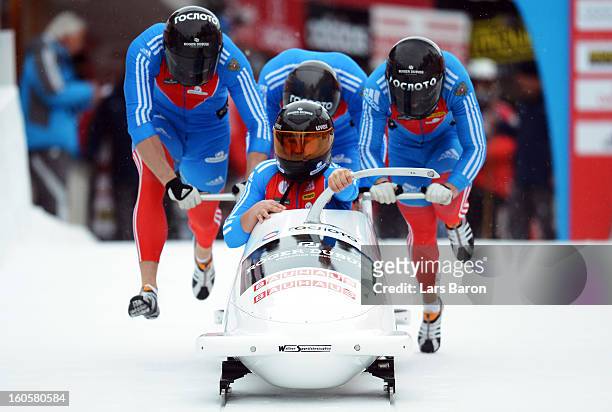 Alexander Kasjanov, Petr Moissev, Maxim Belugin and Kirill Antukh of Russia compete during the Four Men Bobsleigh heat three of the IBSF Bob &...