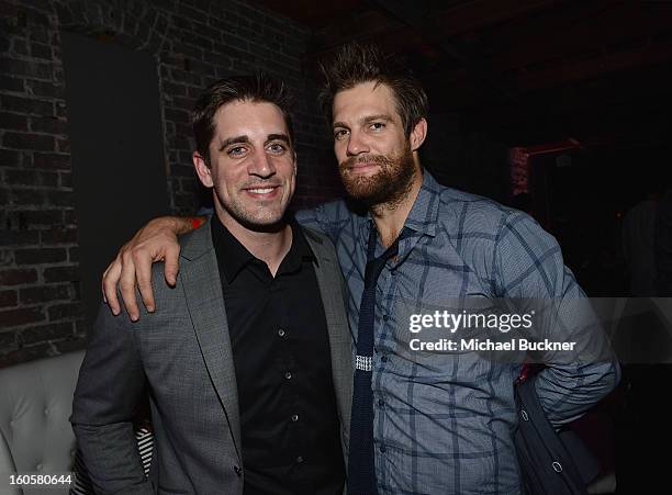 Player Aaron Rodgers and actor Geoff Stults attends the Audi Forum New Orleans at the Ogden Museum of Southern Art on February 2, 2013 in New...