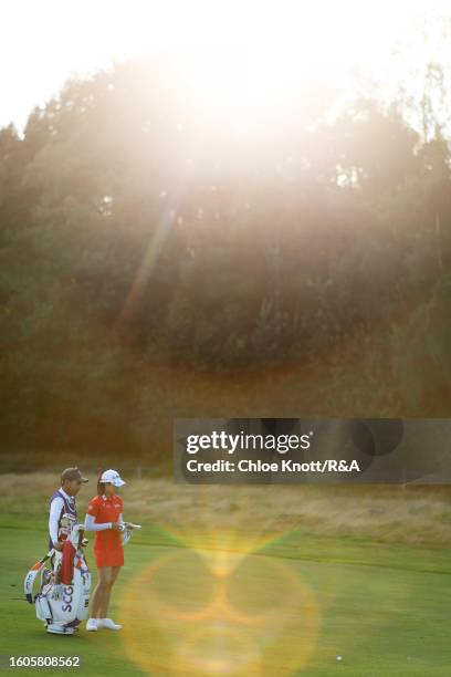 Pajaree Anannarukarn of Thailand talks with her caddie on the 16th hole on Day One of the AIG Women's Open at Walton Heath Golf Club on August 10,...