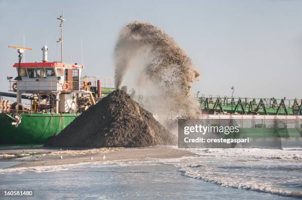 dredge on the beach - dredger stock pictures, royalty-free photos & images