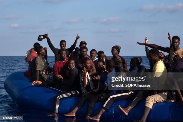 Woman collapses in a migrant boat 27 miles off the coast of Libya minutes before being rescued by Doctors Without Borders SAR team. Doctors Without...