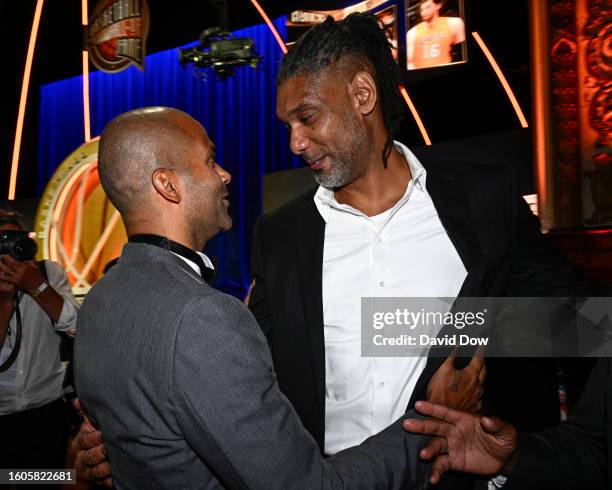 Tony Parker & Tim Duncan embrace during the 2023 Basketball Hall of Fame Enshrinement Ceremony on August 12, 2023 at Springfield Marriott in...