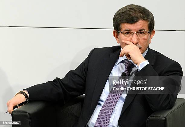 Turkish Foreign Minister Ahmet Davutoglu follows a podium discussion on the third day of the 49th Munich Security Conference on February 3, 2013 in...