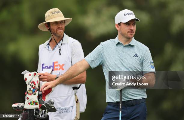 Nick Taylor of Canada and his caddie Dave Markle wait to tee off on the seventh hole during the first round of the FedEx St. Jude Championship at TPC...