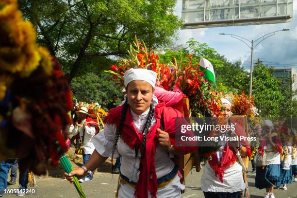 People take part with flowers, dances and cultural parades during the Silleteros parade of Medellin's Feria de las Flores in Colombia, August 7, 2023.