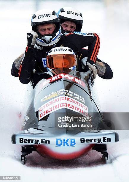 Maximilian Arndt, Marko Huebenbecker, Alexander Roediger and Martin Putze of Germany cellebrates after the Four Men Bobsleigh final heat of the IBSF...