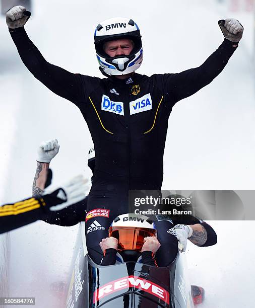 Maximilian Arndt, Marko Huebenbecker, Alexander Roediger and Martin Putze of Germany cellebrates after the Four Men Bobsleigh final heat of the IBSF...