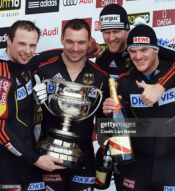 Maximilian Arndt, Marko Huebenbecker, Alexander Roediger and Martin Putze of Germany cellebrate after the Four Men Bobsleigh final heat of the IBSF...