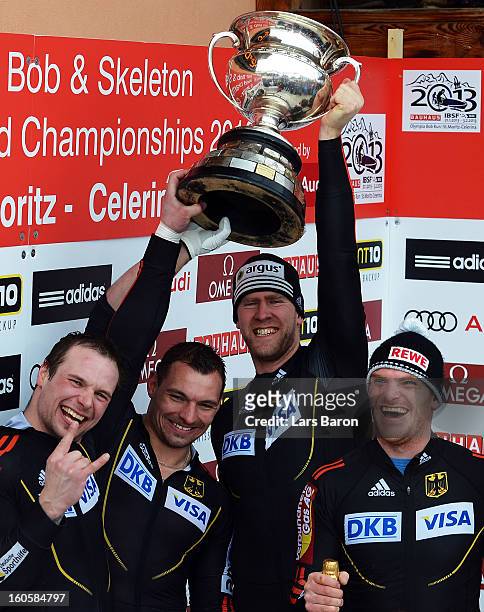 Maximilian Arndt, Marko Huebenbecker, Alexander Roediger and Martin Putze of Germany cellebrate after the Four Men Bobsleigh final heat of the IBSF...