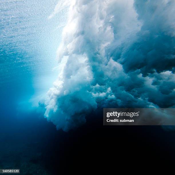 wave crashing underwater - tsunami wave stock pictures, royalty-free photos & images