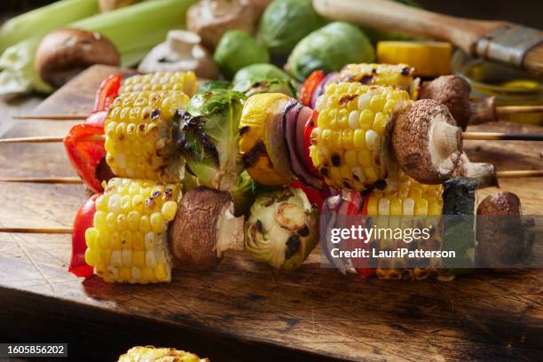 preparing vegetable kebabs - crimini mushroom stock pictures, royalty-free photos & images