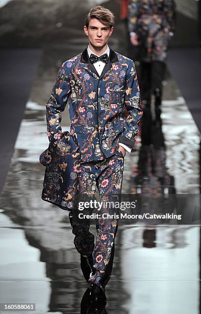 Model walks the runway at the Louis Vuitton Autumn Winter 2013 fashion show during Paris Menswear Fashion Week on January 17, 2013 in Paris, France.