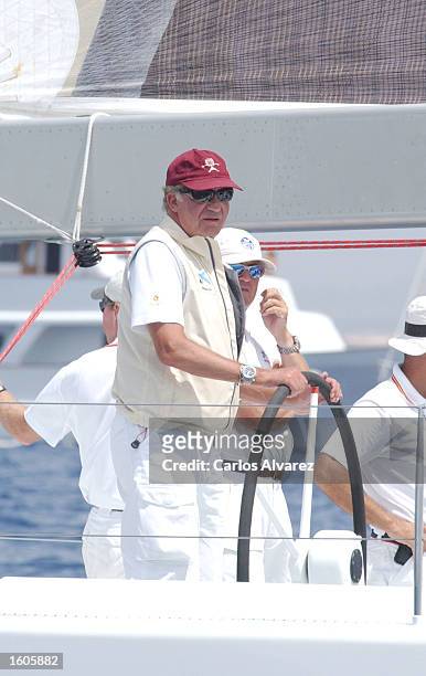 King Juan Carlos steers a ship during the 20th "Copa del Rey" regatta August 1, 2001 on Palma de Mallorca Island, Spain.