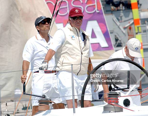 King Juan Carlos of Spain steers a ship during the third day of the 20th "Copa del Rey" regatta August 3, 2001 at Palma de Mallorca Island, Spain.
