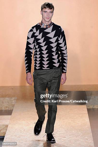 Model walks the runway at the Paul Smith Autumn Winter 2013 fashion show during Paris Menswear Fashion Week on January 20, 2013 in Paris, France.