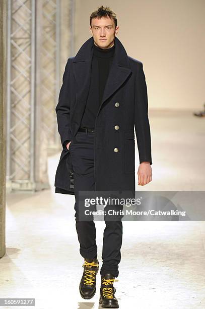 Model walks the runway at the Hermes Autumn Winter 2013 fashion show during Paris Menswear Fashion Week on January 19, 2013 in Paris, France.