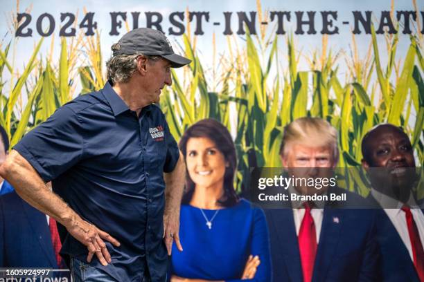 North Dakota Gov. And Republican presidential candidate Doug Burgum prepares to speak to the media at the Iowa State Fair on August 10, 2023 in Des...