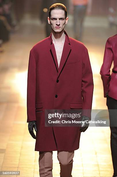 Model walks the runway at the Lanvin Autumn Winter 2013 fashion show during Paris Menswear Fashion Week on January 20, 2013 in Paris, France.