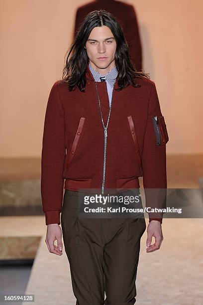 Model walks the runway at the Paul Smith Autumn Winter 2013 fashion show during Paris Menswear Fashion Week on January 20, 2013 in Paris, France.