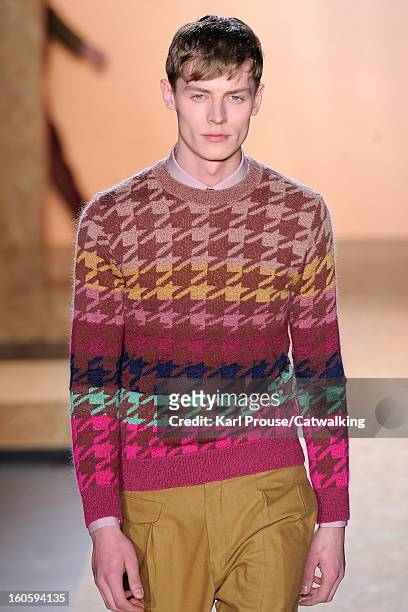 Model walks the runway at the Paul Smith Autumn Winter 2013 fashion show during Paris Menswear Fashion Week on January 20, 2013 in Paris, France.