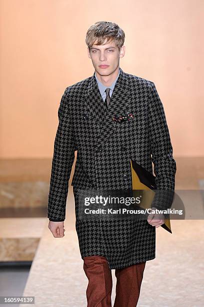 Model walks the runway at the Paul Smith Autumn Winter 2013 fashion show during Paris Menswear Fashion Week on January 20, 2013 in Paris, France.