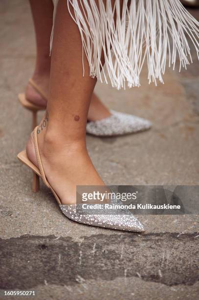 Guest wears pointy beige shoes outside Lovechild 1979 during the Copenhagen Fashion Week Spring/Summer 2024 on August 8, 2023 in Copenhagen, Denmark.