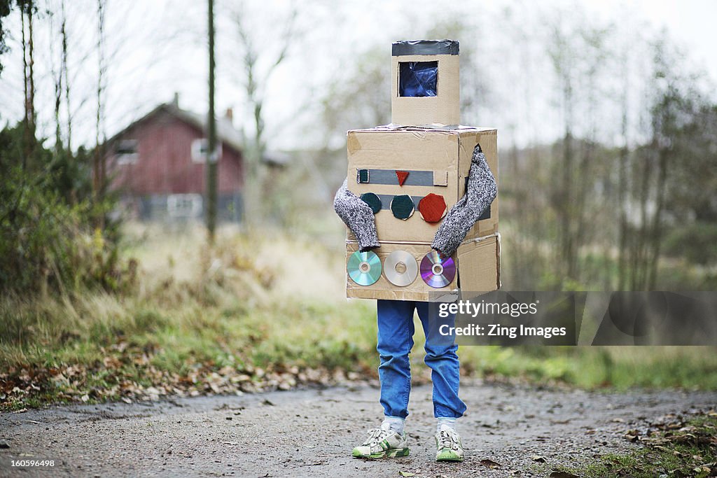 Boy dressed as robot outdoors