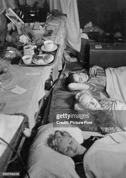 New rules for the dancers at the Windmill theatre, lights out at 11, the girls sleep on the floor of their dressing room as they eat, sleep and work...