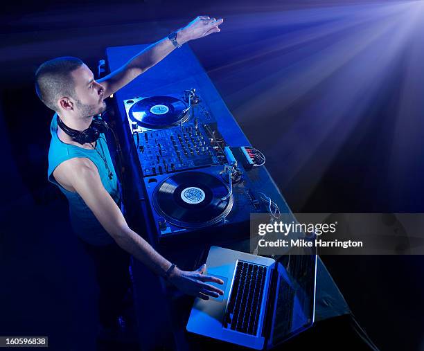 male dj reaching out to club audience - dj table stock pictures, royalty-free photos & images