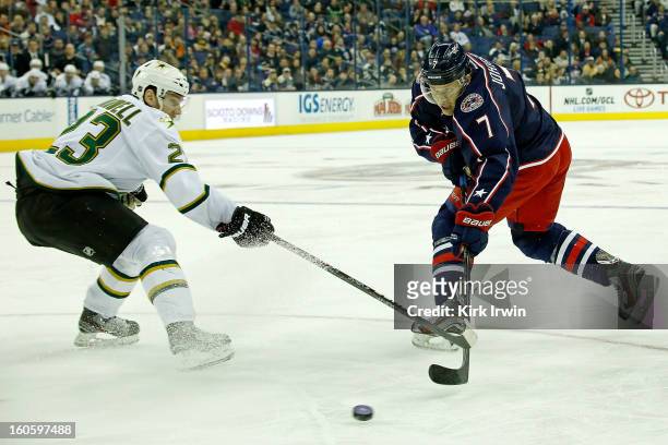 Jack Johnson of the Columbus Blue Jackets shoots the puck past Tom Wandell of the Dallas Stars on January 28, 2013 at Nationwide Arena in Columbus,...
