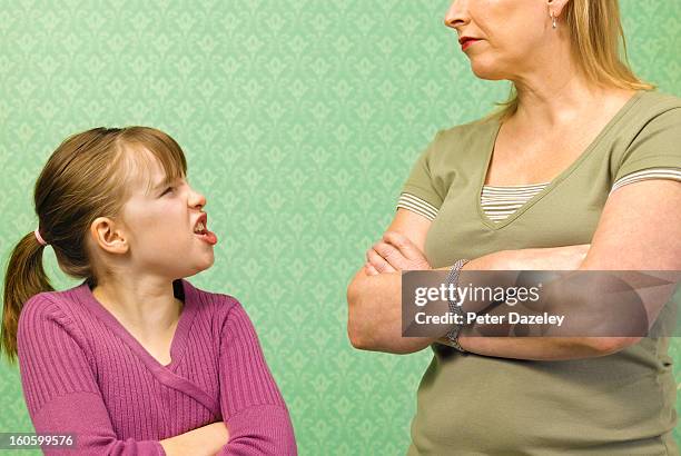 girl shouting at mother - mom arms crossed stock pictures, royalty-free photos & images