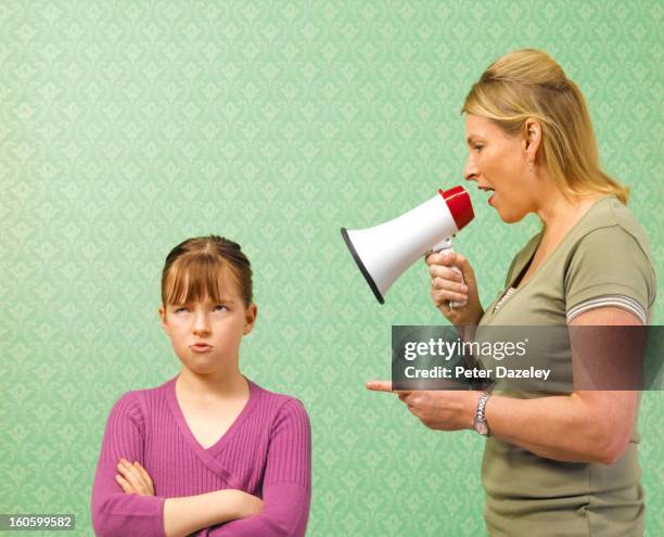 mother screaming at daughter - mom arms crossed stock pictures, royalty-free photos & images