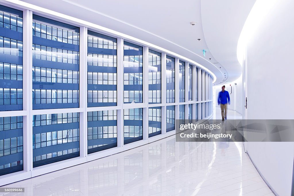 Businessmen walking in a modern interior