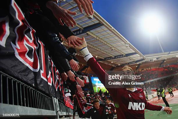 Javier Pinola of Nuernberg celebrates with the fans after the Bundesliga match between 1. FC Nuernberg and VfL Borussia Moenchengladbach at Easy...