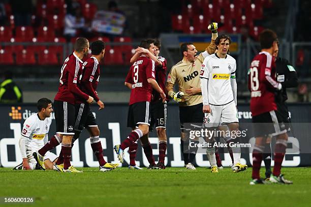 Roel Brouwers of Moenchengladbach reacts as players of Nuernberg celebrate after the Bundesliga match between 1. FC Nuernberg and VfL Borussia...