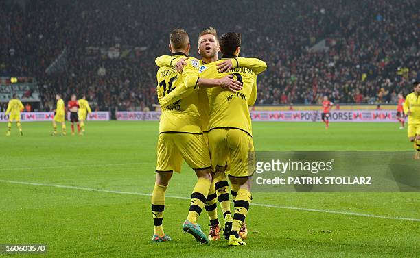 Dortmund's Polish striker Robert Lewandowski , Dortmund's Polish midfielder Jakub Blaszczykowski and Dortmund's Polish defender Lukasz Piszczek...