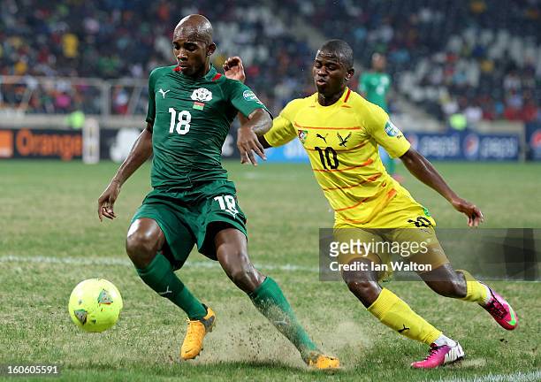Ayite Floyd Ama of Togo tries to tackle Kabore Charles of Burkina Faso during the 2013 Africa Cup of Nations Quarter-Final match between Burkina Faso...