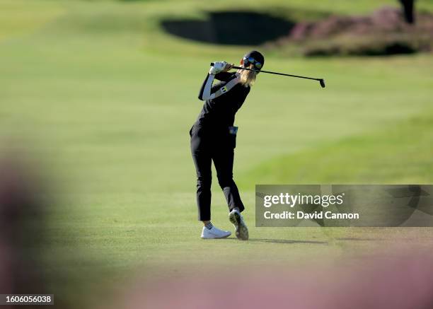 Hinako Shibano of Japan plays her second shot on the third hole during the first round of the AIG Women's Open at Walton Heath Golf Club on August...