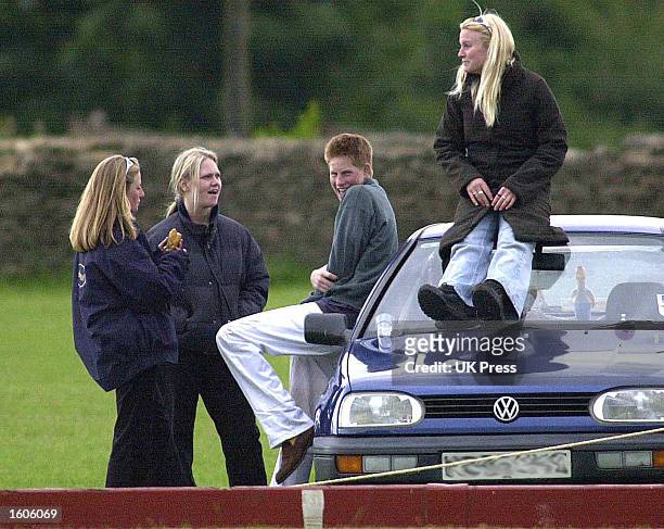 Britain''s Prince Harry spends time with three female friends June 9, 2001 at the Beaufort Polo Club near Tetbury in Gloucestershire, England.