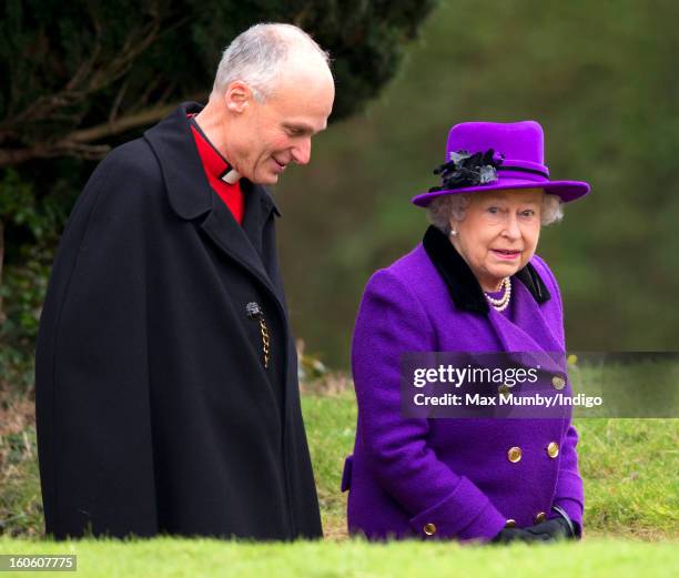 Reverend Jonathan Riviere and Queen Elizabeth II arrive at the church of St Peter and St Paul in West Newton to attend Sunday service on February 03,...