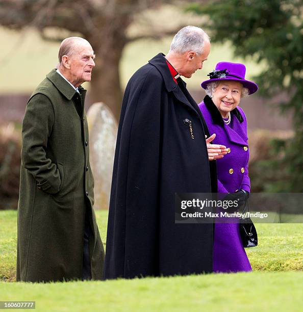 Prince Philip, Duke of Edinburgh, Reverend Jonathan Riviere and Queen Elizabeth II arrive at the church of St Peter and St Paul in West Newton to...