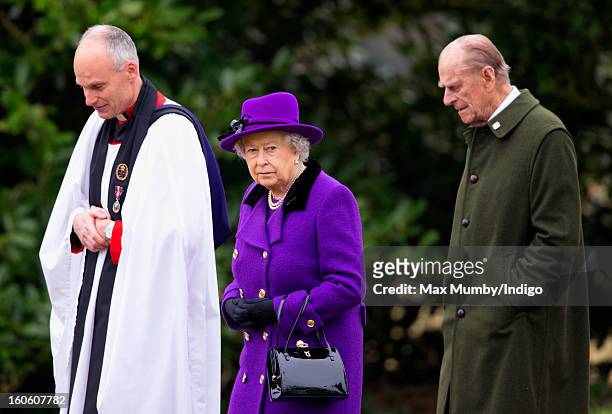 Reverend Jonathan Riviere, Queen Elizabeth II and Prince Philip, Duke of Edinburgh leave the church of St Peter and St Paul in West Newton after...