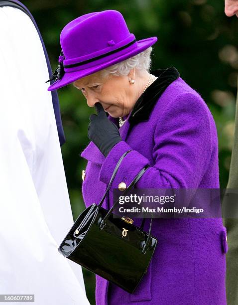 Queen Elizabeth II leaves the church of St Peter and St Paul in West Newton after attending Sunday service on February 03, 2013 near King's Lynn,...