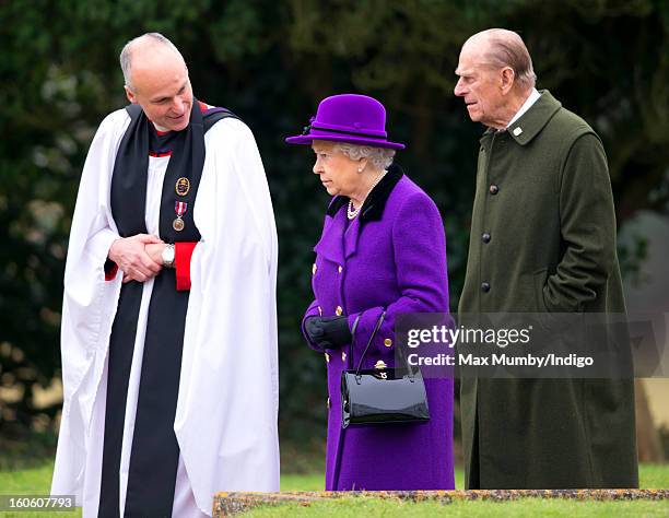 Reverend Jonathan Riviere, Queen Elizabeth II and Prince Philip, Duke of Edinburgh leave the church of St Peter and St Paul in West Newton after...