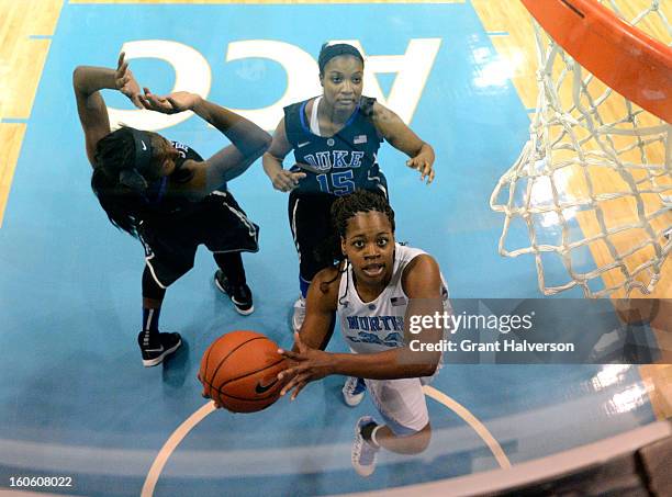Xylina McDaniel of the North Carolina Tar Heels drives past Richa Jackson of the Duke Blue Devils during play at Carmichael Arena on February 3, 2013...