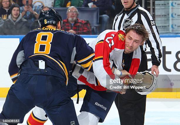 Cody McCormick of the Buffalo Sabres knocks the helmet of Tyson Strachan of the Florida Panthers off with a punch on February 3, 2013 at the First...